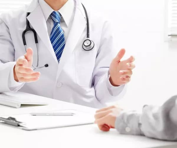 A primary care doctor offering advice to a patient